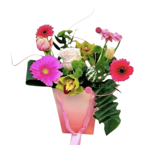 Colourful flower arrangement in gift bag with gerberas and roses Malta