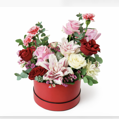 Romantic flower box with roses and lilies in hat box Malta